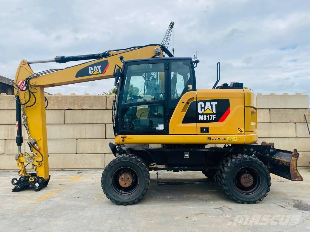 CAT m317f Ekskavatori uz riteņiem