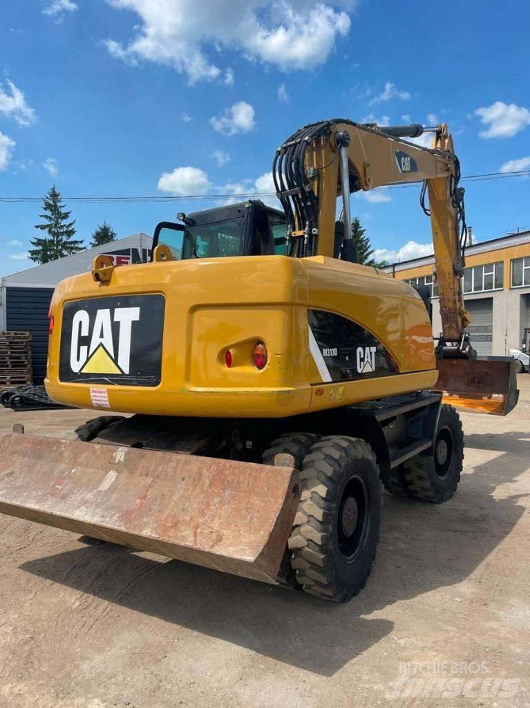 CAT M 313 D Ekskavatori uz riteņiem
