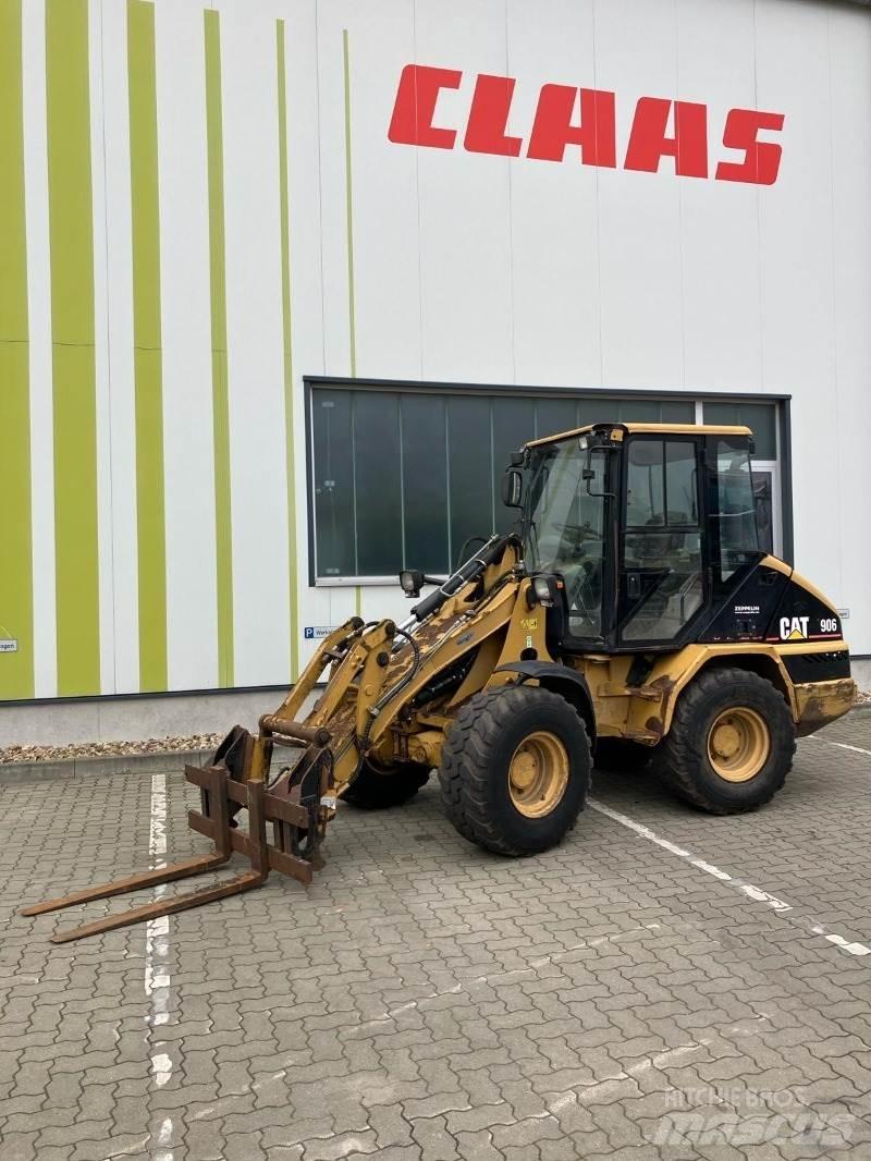 CAT 906 Iekrāvēji uz riteņiem