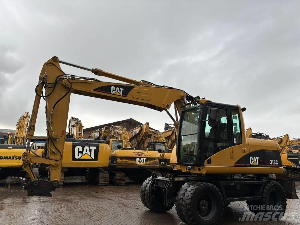 CAT M 313 C Ekskavatori uz riteņiem