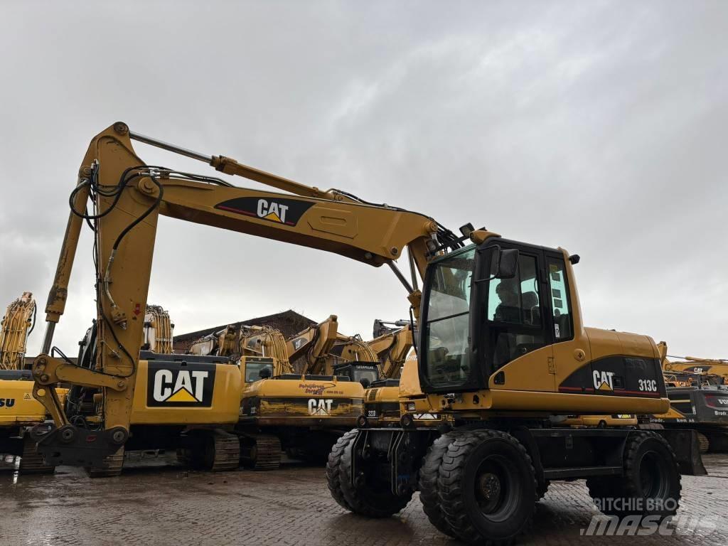 CAT M 313 C Ekskavatori uz riteņiem
