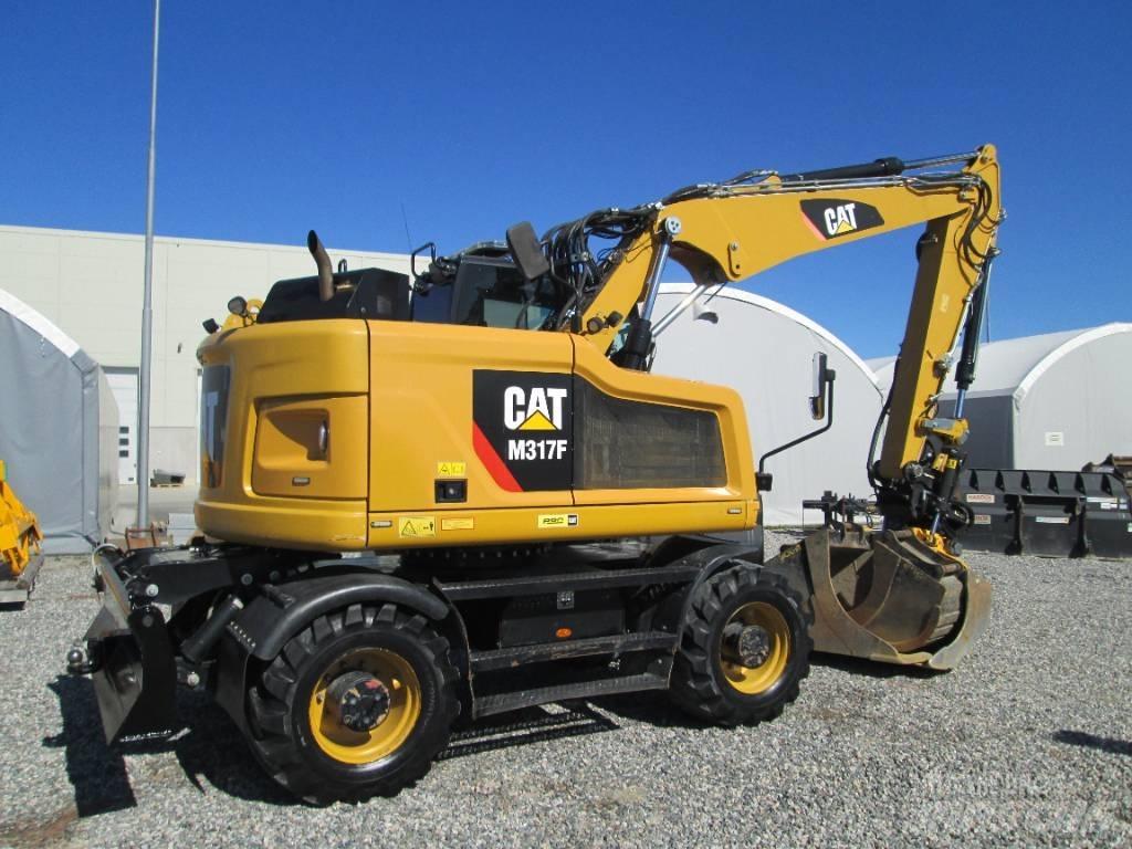 CAT M 317F Ekskavatori uz riteņiem