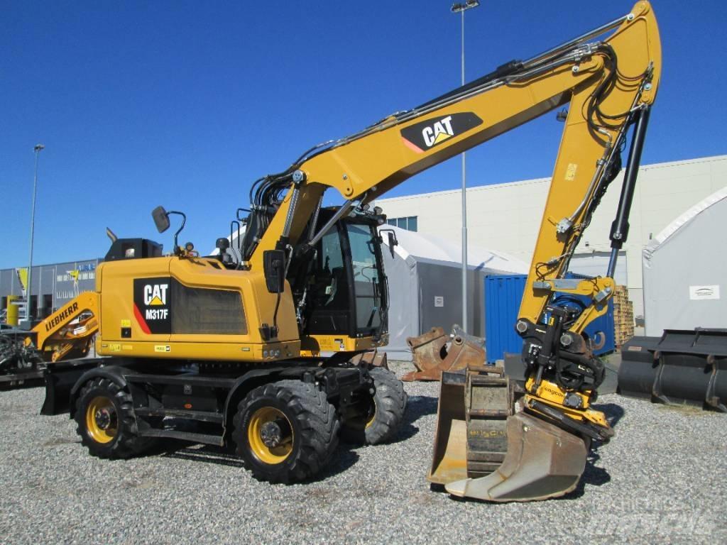 CAT M 317F Ekskavatori uz riteņiem