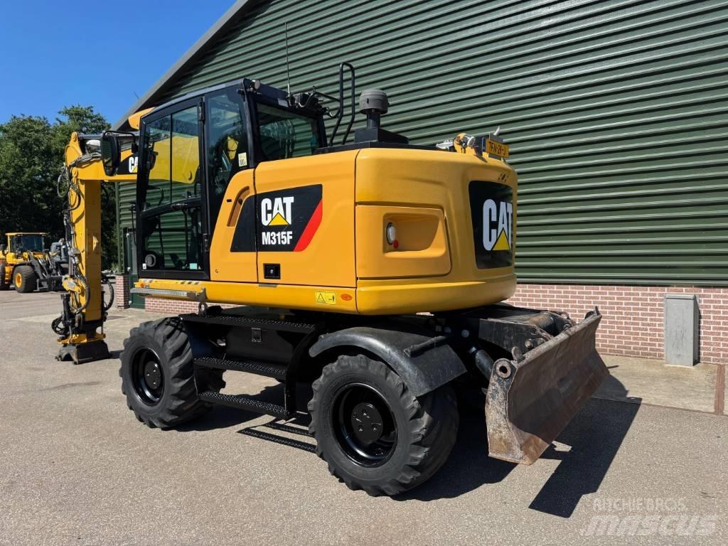 CAT M 315 F Ekskavatori uz riteņiem