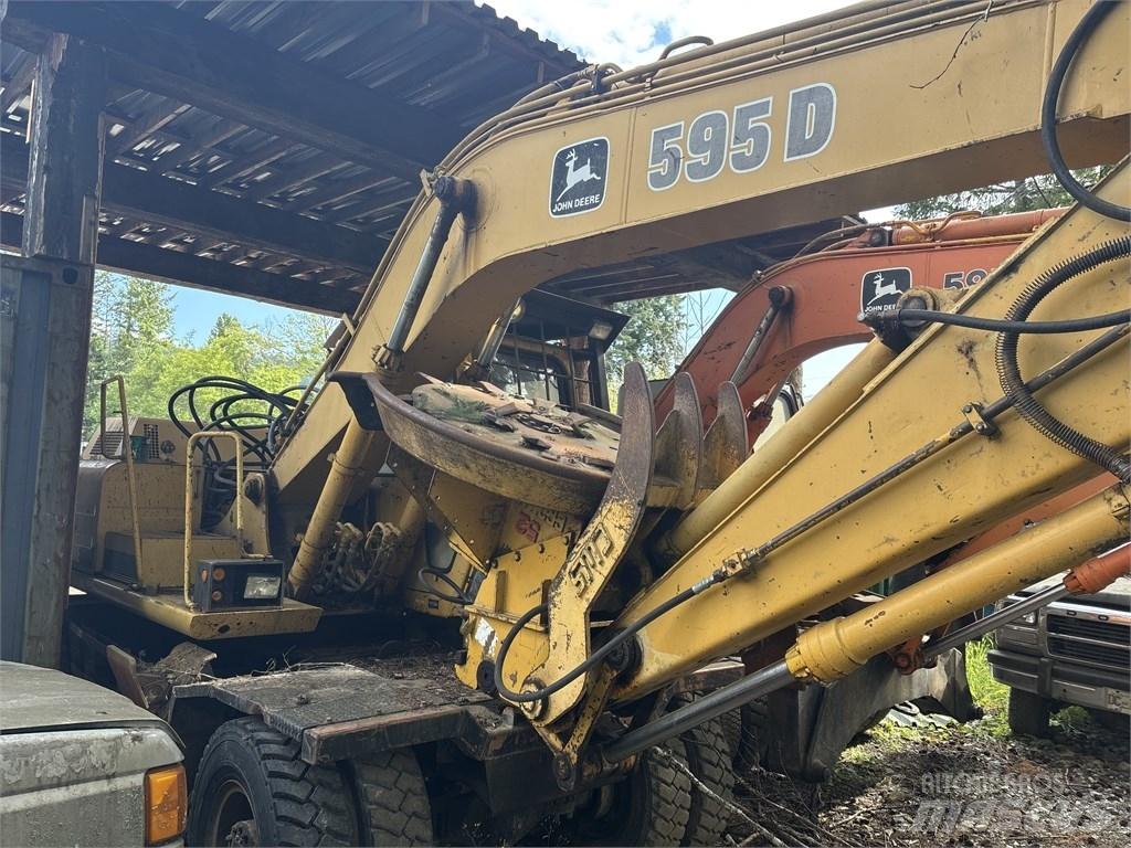 DEERE 595D Ekskavatori uz riteņiem