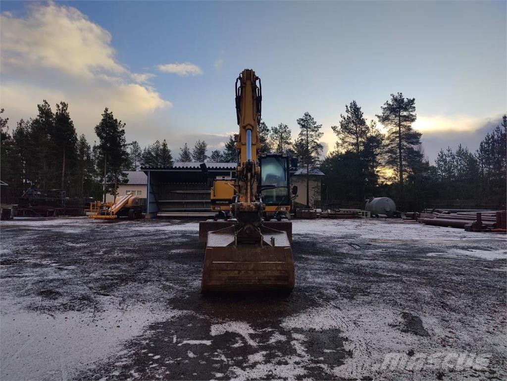 CAT M315 Ekskavatori uz riteņiem