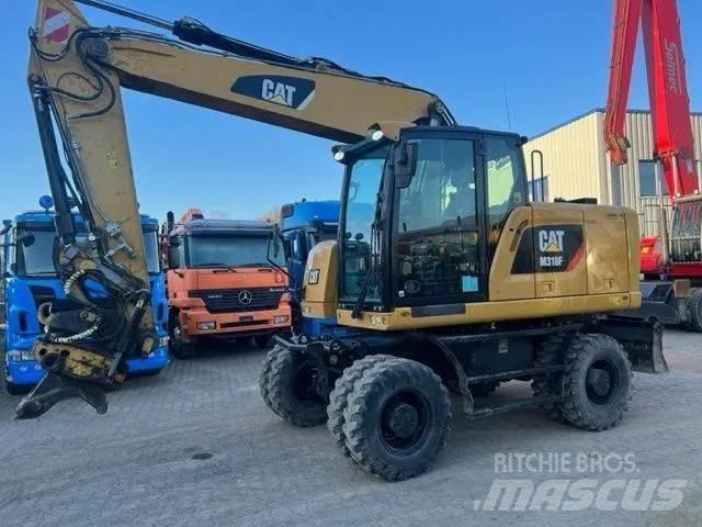 CAT M 318 F Ekskavatori uz riteņiem
