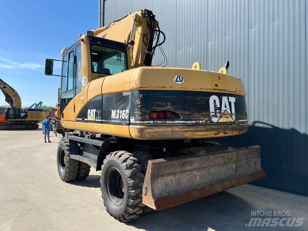CAT M316C Ekskavatori uz riteņiem