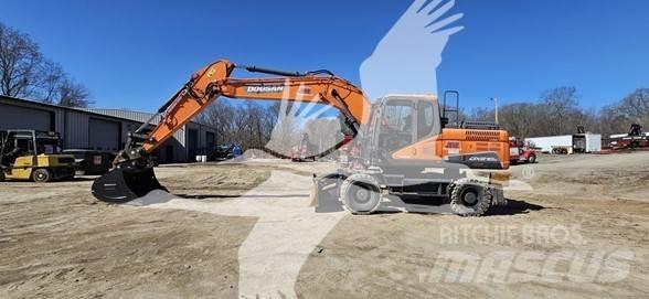 Doosan DX210W Ekskavatori uz riteņiem