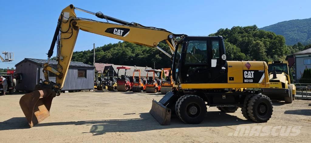 CAT M 315 D Ekskavatori uz riteņiem