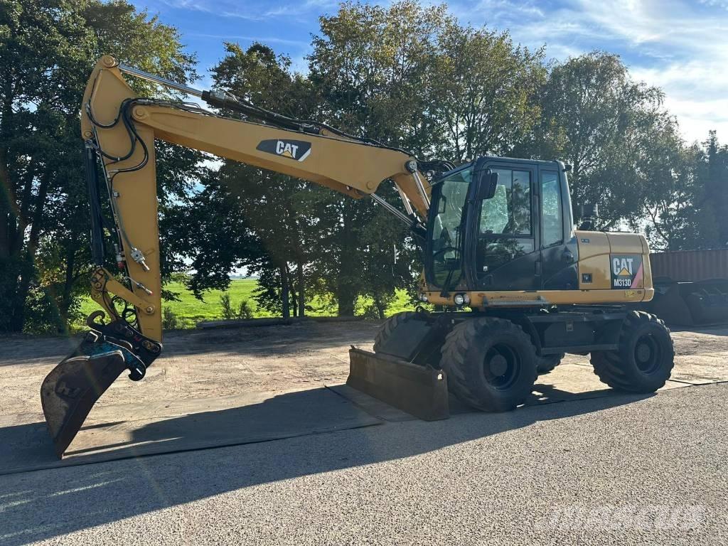 CAT M 313 D - 13.285H Ekskavatori uz riteņiem