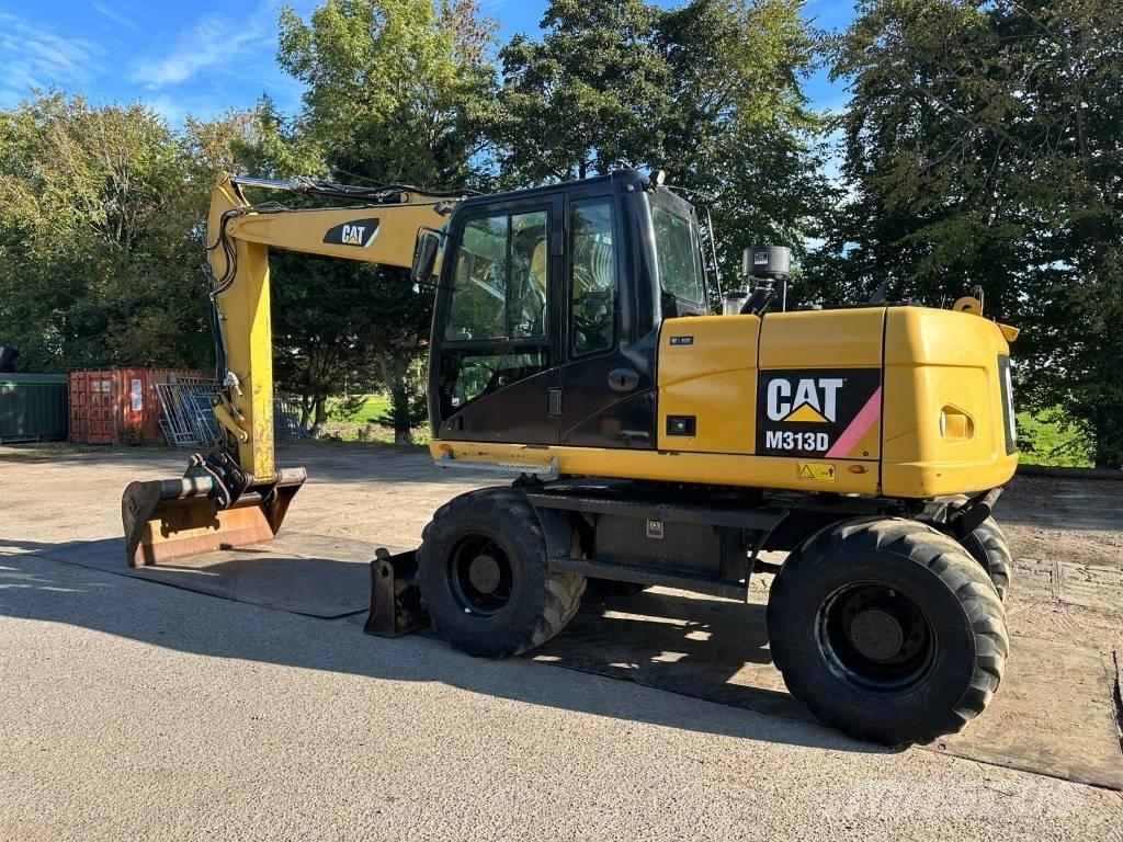 CAT M 313 D - 13.285H Ekskavatori uz riteņiem