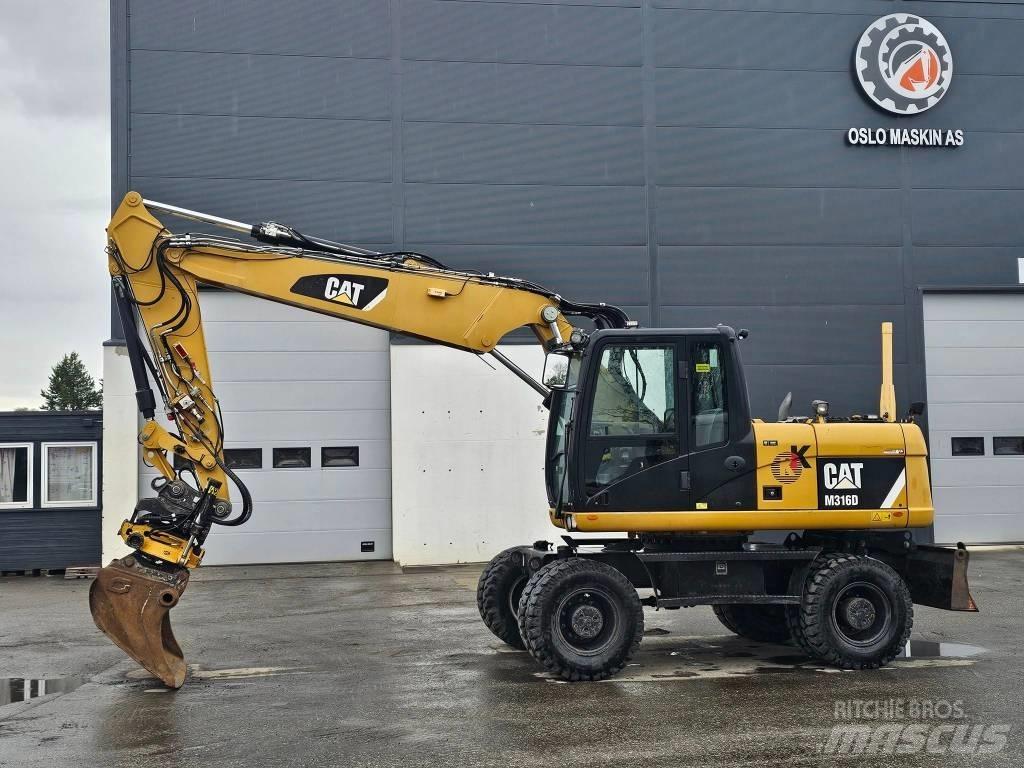 CAT M 316 D Ekskavatori uz riteņiem