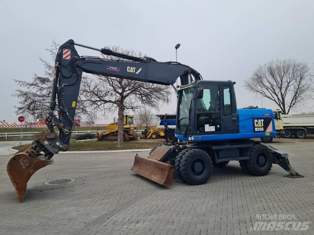 CAT M315D 2 buckets Ekskavatori uz riteņiem