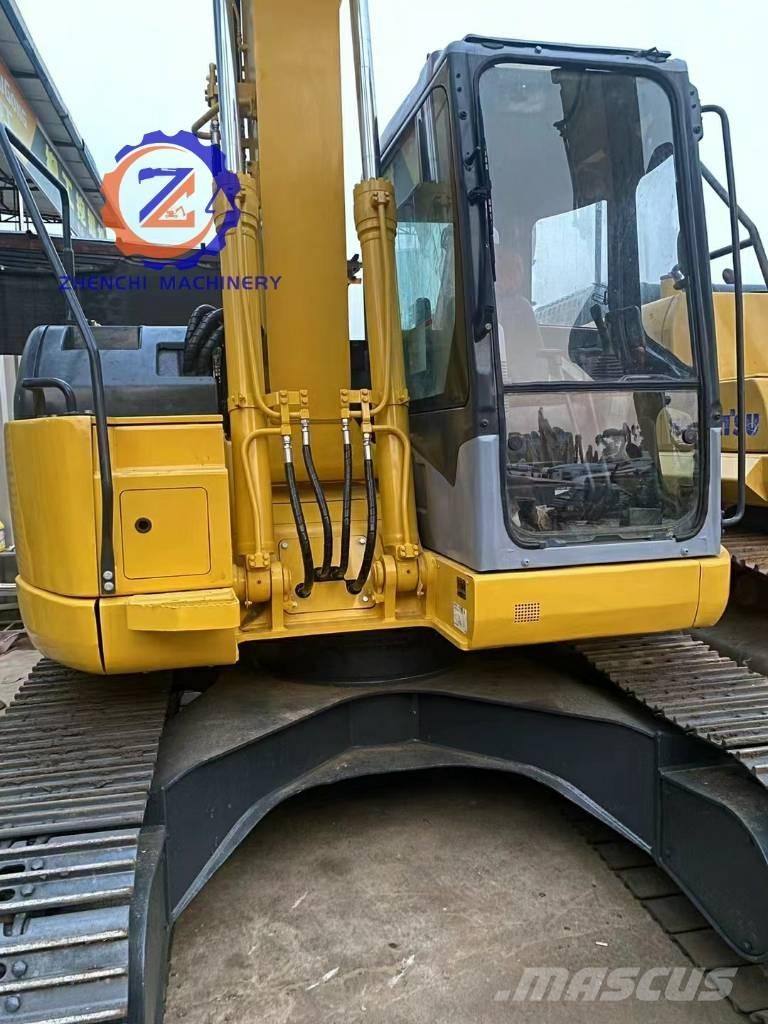 Komatsu PC 128 US Vidēja lieluma ekskavatori 7 t - 12 t