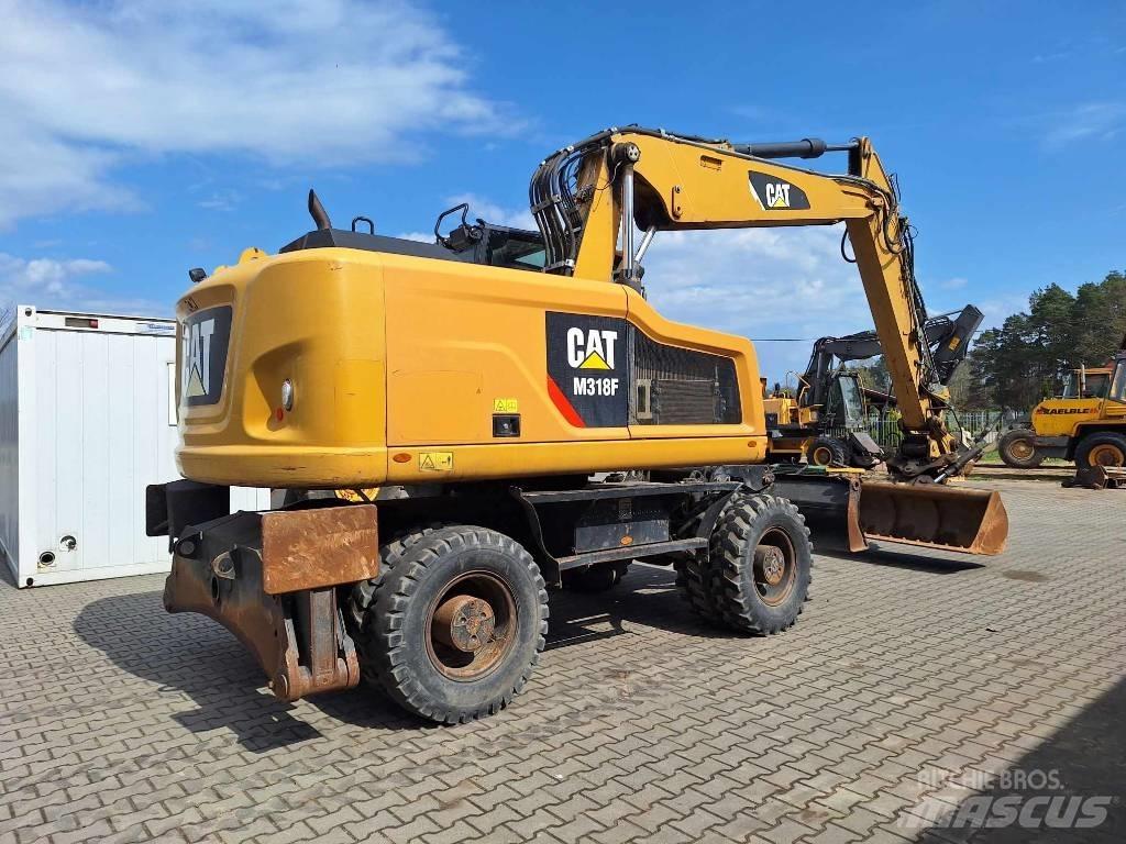 CAT M 318 F Ekskavatori uz riteņiem