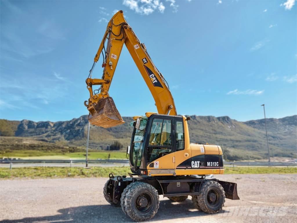 CAT M 313 C Ekskavatori uz riteņiem