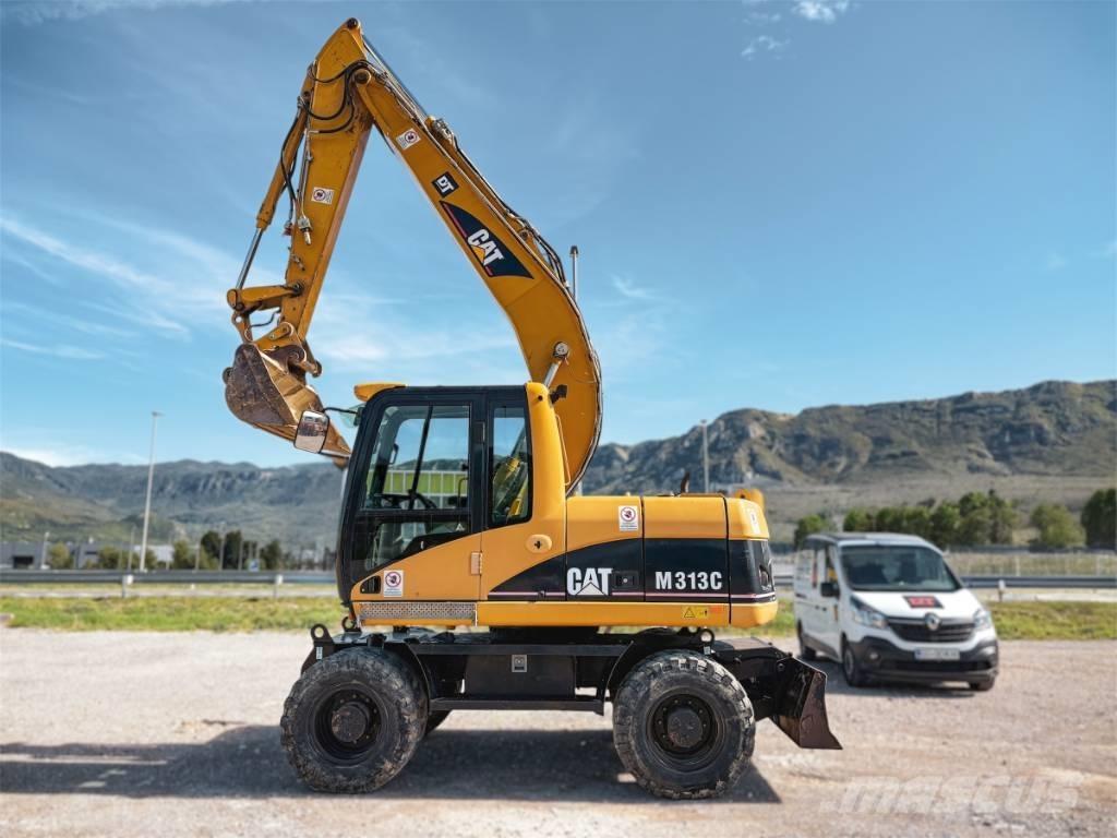 CAT M 313 C Ekskavatori uz riteņiem