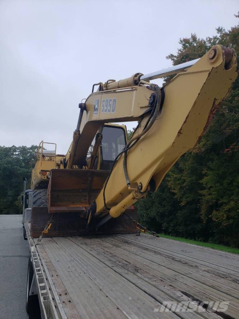 John Deere 595D Ekskavatori uz riteņiem