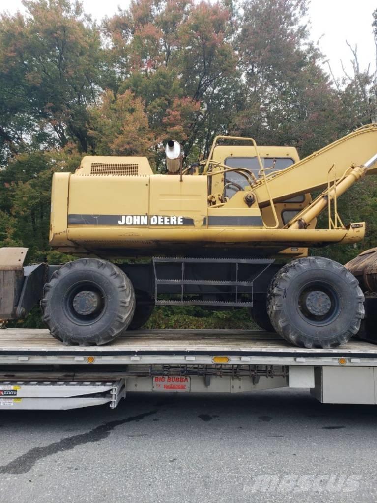 John Deere 595D Ekskavatori uz riteņiem