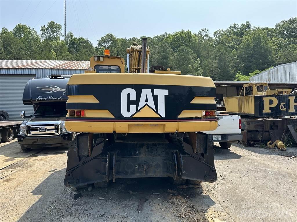 CAT M320 Ekskavatori uz riteņiem