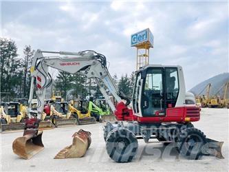 Takeuchi TB295W Ekskavatori uz riteņiem