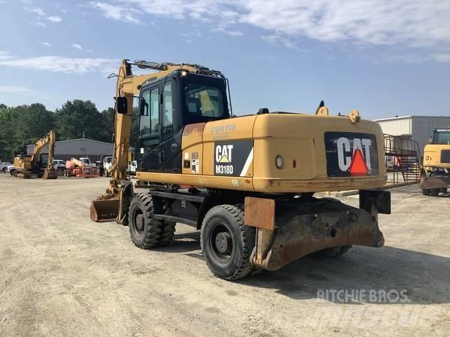 CAT M318D Ekskavatori uz riteņiem