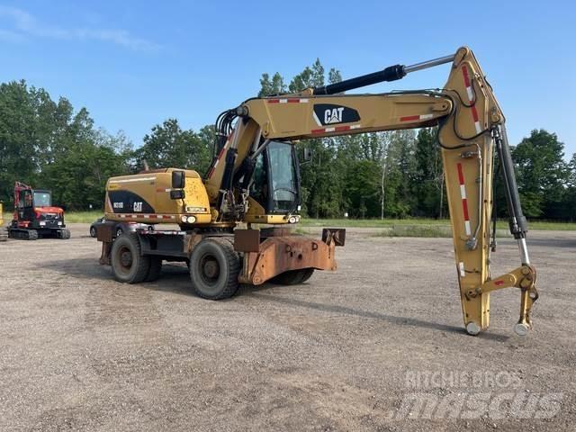 CAT M318D Ekskavatori uz riteņiem