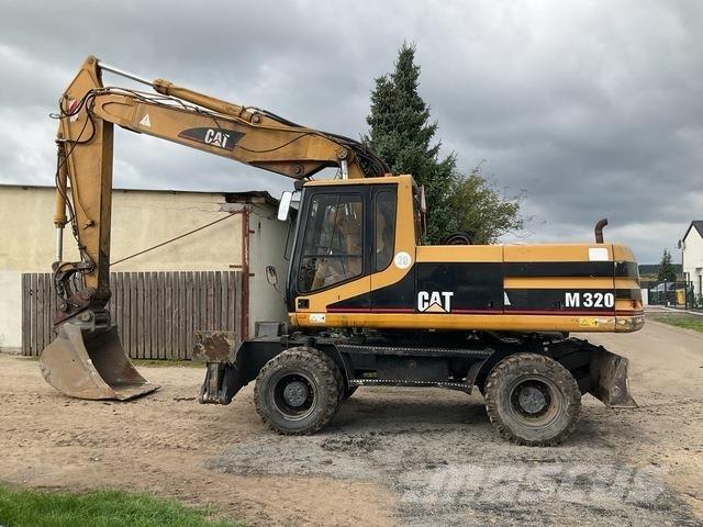 CAT M320 Ekskavatori uz riteņiem