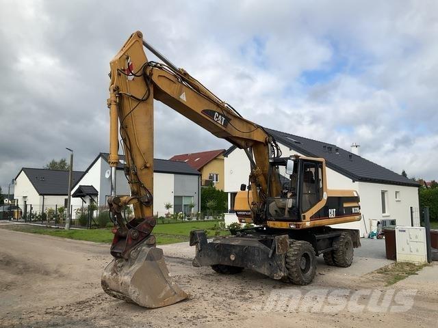 CAT M320 Ekskavatori uz riteņiem
