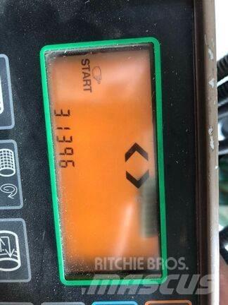 John Deere 590 Rituļu preses