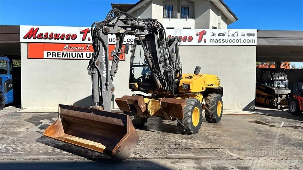 Mecalac 12MXT - E Ekskavatori uz riteņiem