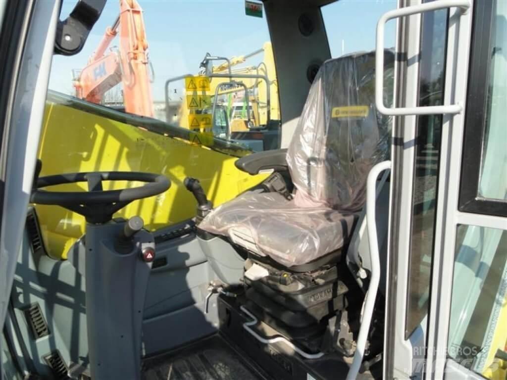 New Holland WE210 Ekskavatori uz riteņiem