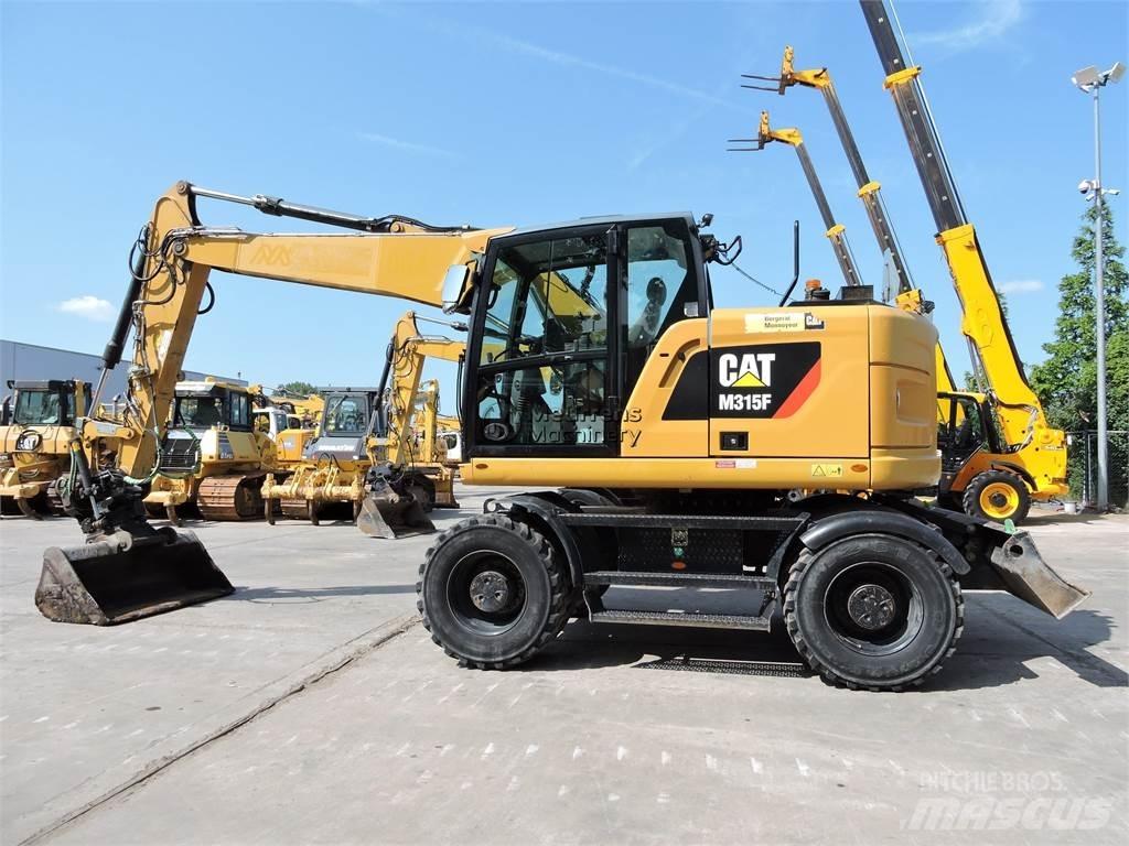 CAT M315 Ekskavatori uz riteņiem