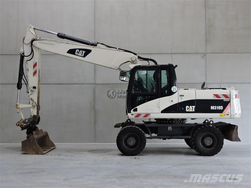 CAT M318D Ekskavatori uz riteņiem