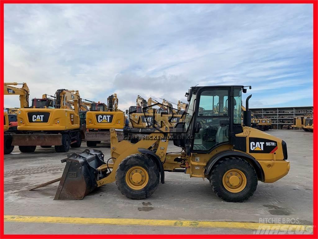 CAT 907H2 Iekrāvēji uz riteņiem