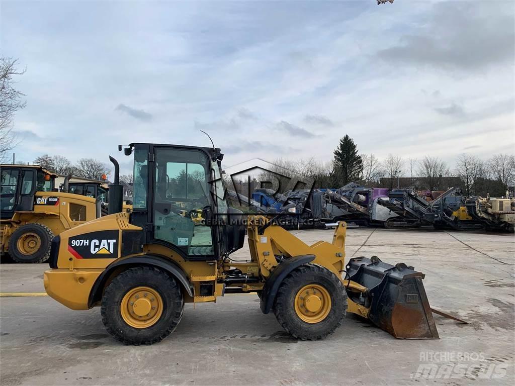 CAT 907H2 Iekrāvēji uz riteņiem