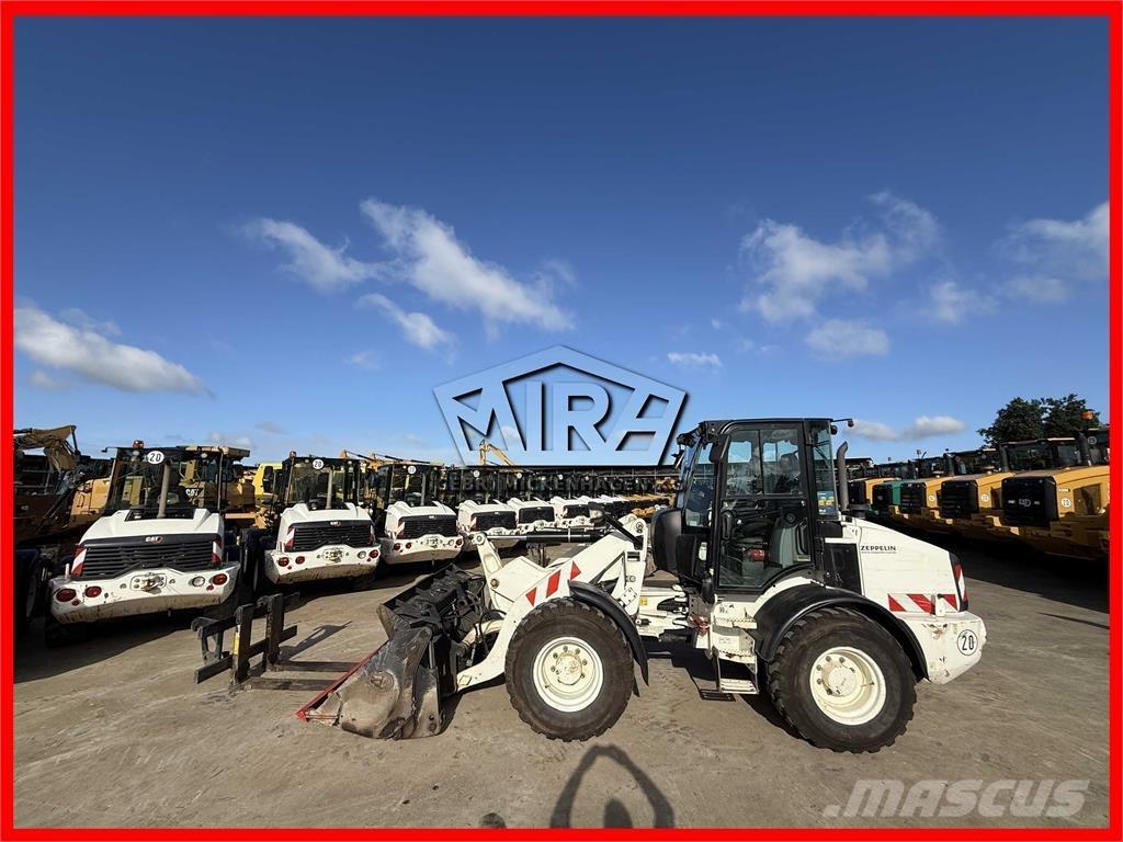 CAT 908M Iekrāvēji uz riteņiem
