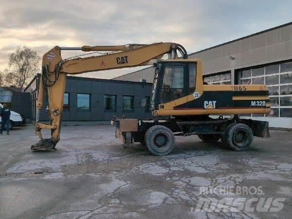 CAT M320 Ekskavatori uz riteņiem