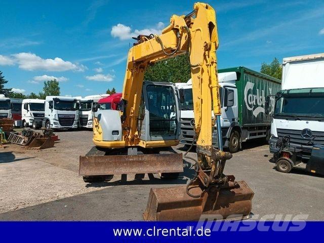 New Holland E70SR 4 Ekskavatori-iekrāvēji