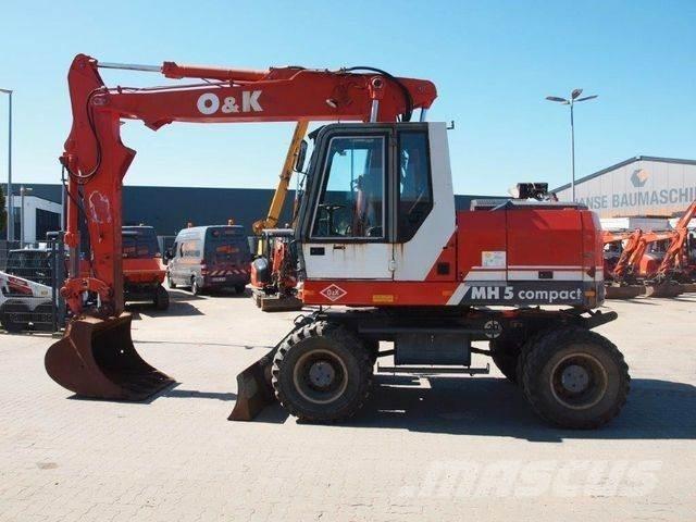 O&K MH 5 Compakt Ekskavatori uz riteņiem