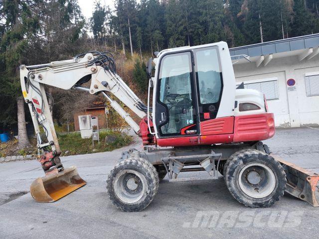 Takeuchi TB295W Ekskavatori uz riteņiem
