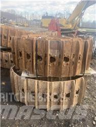 CAT 325 Sliedes, ķēdes un šasija