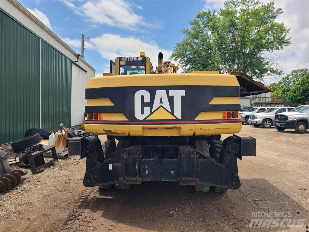CAT M320 Ekskavatori uz riteņiem
