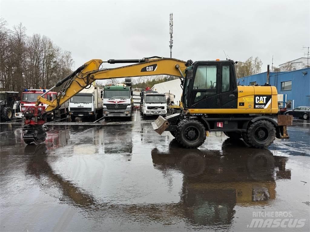 CAT M313 D Ekskavatori uz riteņiem