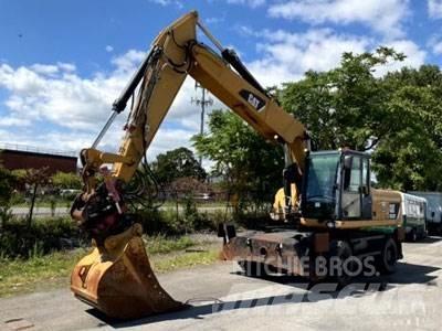 CAT M322D Ekskavatori uz riteņiem
