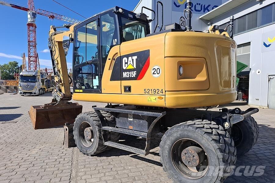 CAT M 315 F Ekskavatori uz riteņiem