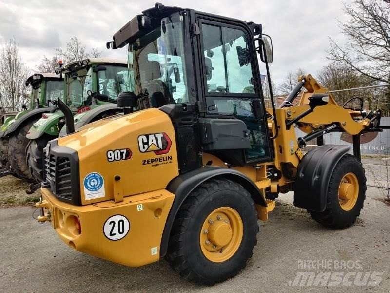 CAT 907 Iekrāvēji uz riteņiem