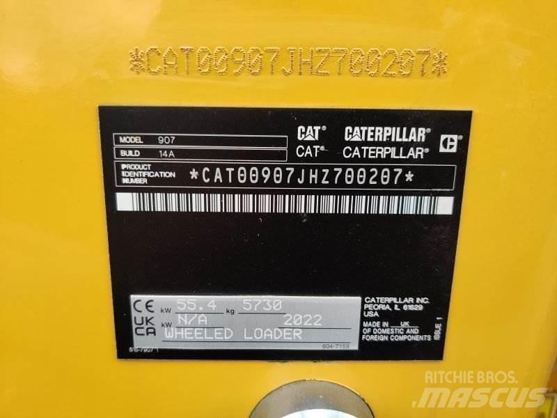 CAT 907 Iekrāvēji uz riteņiem