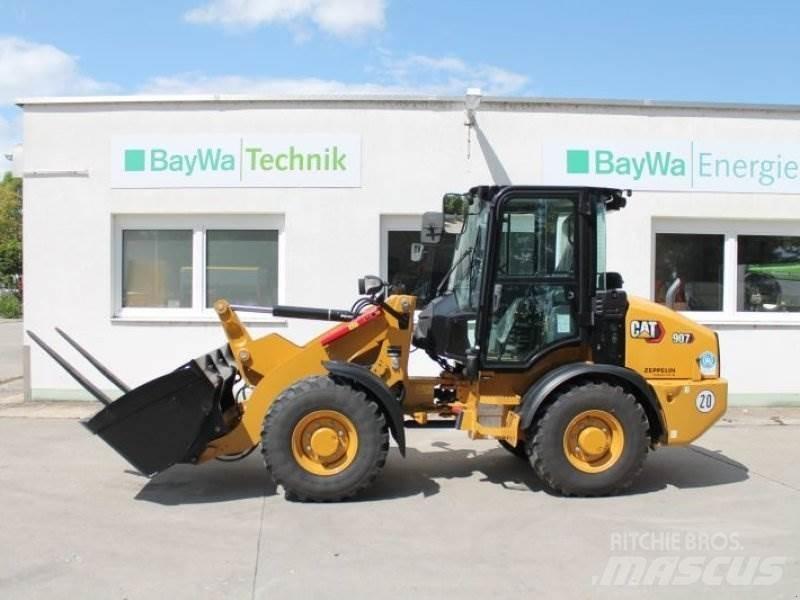 CAT 907 Iekrāvēji uz riteņiem